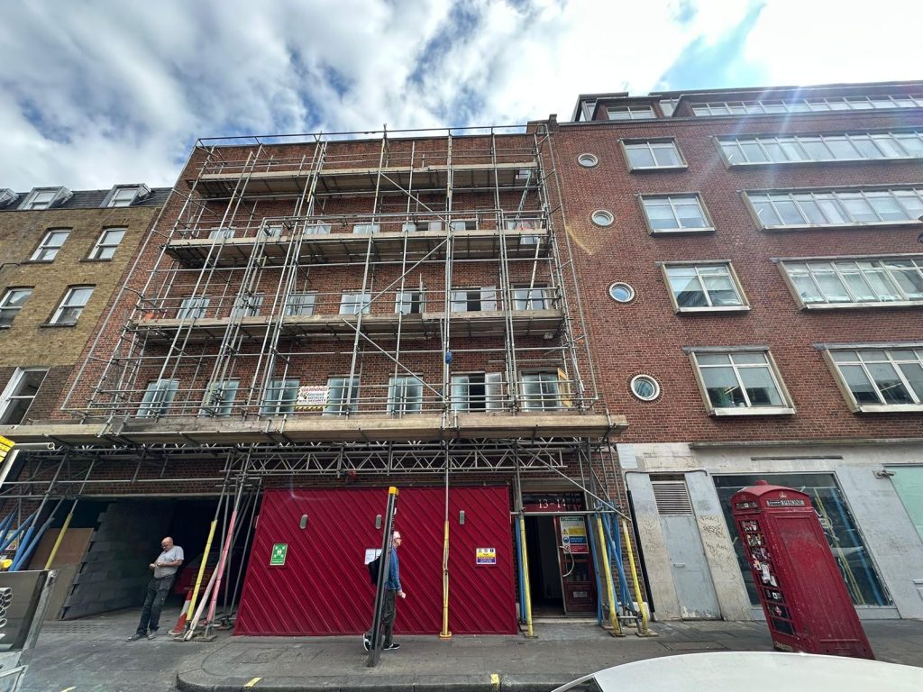 Full scaffolding structure in Westminster London on Dean Street, erected for roof access and building works.